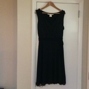 Sleeveless fully lined black polka dot dress